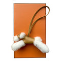 Decorative item with white fluffy details on an orange background