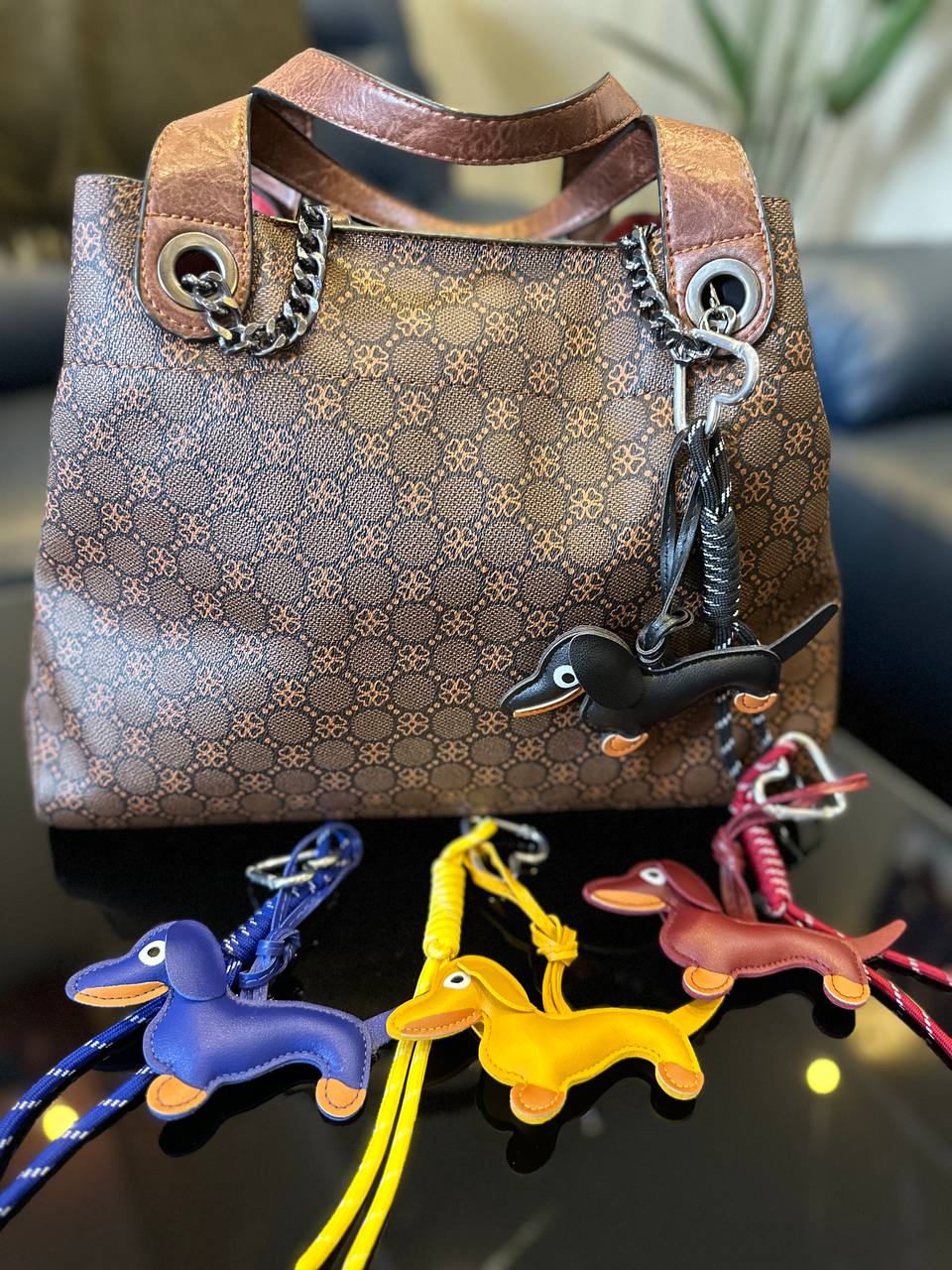 dachshund-shaped keychains on a Patterned handbag 