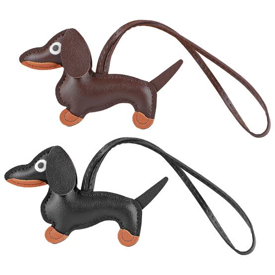 Two dachshund-shaped keychains, one brown and one black, on a white background.